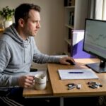 Crypto investor checking charts in home office