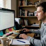 Person monitoring crypto dashboard at home desk